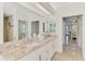 Bright bathroom featuring a double vanity and view of the bedroom and shower at 854 Blue Crane Dr, Venice, FL 34285