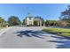 Community entrance gate with pretty landscaping, lovely architecture, and a welcoming appearance to residents at 854 Blue Crane Dr, Venice, FL 34285