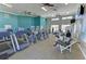 Well-equipped fitness center with cardio machines and weights at Pelican Pointe Golf and Country Club at 854 Blue Crane Dr, Venice, FL 34285