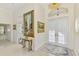 Grand foyer featuring high ceilings, gleaming tile floors, and elegant decor with a view of the front door at 854 Blue Crane Dr, Venice, FL 34285