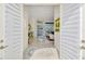 Bright foyer with shuttered sidelights, tile floors, and an inviting view into the elegant living spaces at 854 Blue Crane Dr, Venice, FL 34285