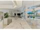 Bright kitchen showcasing granite countertops, stainless appliances, an eat-in dining area, and serene outdoor views at 854 Blue Crane Dr, Venice, FL 34285