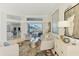Comfortable living room with modern decor, gleaming tile floors, and a view of the pool and outdoor area at 854 Blue Crane Dr, Venice, FL 34285