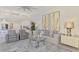Open-concept living room with eat-in kitchen, comfortable seating, and view into the kitchen at 854 Blue Crane Dr, Venice, FL 34285