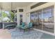 Outdoor patio seating featuring an area rug, view of the golf course, and spa at 854 Blue Crane Dr, Venice, FL 34285