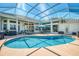 Stunning private pool boasts screened-in enclosure and golf course views at 854 Blue Crane Dr, Venice, FL 34285