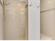 Modern walk-in shower with dual shower heads and decorative tile accents at 854 Blue Crane Dr, Venice, FL 34285