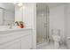 Bright bathroom featuring a vanity and walk-in shower at 930 Capri Isles Blvd # 120, Venice, FL 34292