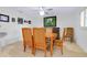 Charming dining room featuring a classic wood table, comfortable seating and unique decor at 990 Sea Fox Rd, Venice, FL 34293