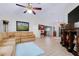 Bright living room featuring vaulted ceilings, light wood floors, and a decorative display shelf at 990 Sea Fox Rd, Venice, FL 34293