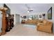 Open-concept living room featuring light wood floors, modern furnishings, and ample natural light at 990 Sea Fox Rd, Venice, FL 34293