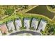 Overhead angle of backyard neighborhood with pools, ponds, green spaces and cul-de-sac at 10136 Coral Shore Dr, Englewood, FL 34223