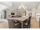 Open floor plan showcasing the dining area and kitchen, promoting seamless living and entertaining at 10136 Coral Shore Dr, Englewood, FL 34223