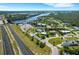 Beautiful view of a suburban neighborhood with waterfront homes, and lush greenery at 106 Playmore Dr, Venice, FL 34293