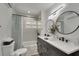 Stylish bathroom boasts double sinks with sleek black fixtures and modern lighting at 106 Playmore Dr, Venice, FL 34293