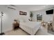 Bright bedroom features wood floors, modern design and furnishings and a view to the backyard at 106 Playmore Dr, Venice, FL 34293