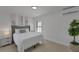 Bright bedroom featuring a comfortable bed, stylish decor, and serene ambiance at 106 Playmore Dr, Venice, FL 34293