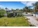 Modern home with manicured lawn and private fenced yard, creating a serene living space at 106 Playmore Dr, Venice, FL 34293