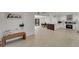 Bright open-concept with modern fixtures, an island, and a seamless transition to the dining area at 106 Playmore Dr, Venice, FL 34293