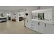 Spacious home showcasing an open layout with seamless kitchen, living, and dining transitions at 106 Playmore Dr, Venice, FL 34293