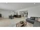 Open-concept living space includes kitchen, dining area, and living room, perfect for entertaining at 106 Playmore Dr, Venice, FL 34293