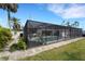 The home has a screened-in pool and outdoor kitchen, creating a perfect oasis for entertaining and relaxation at 106 Playmore Dr, Venice, FL 34293