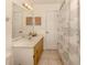 Bathroom with modern vanity and shower with curtain at 1101 Southland Rd, Venice, FL 34293