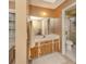 Bathroom with tile floor, wood vanity, and shower at 1101 Southland Rd, Venice, FL 34293