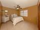 Cozy bedroom with tile floors, neutral color, ceiling fan and natural lighting at 1101 Southland Rd, Venice, FL 34293