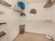 Walk-in closet with organized shelving, baskets, and storage space at 1101 Southland Rd, Venice, FL 34293