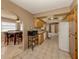 View of kitchen with wooden cabinetry, laminate countertops, and tile flooring at 1101 Southland Rd, Venice, FL 34293