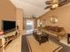 Open living room with tile floors, ceiling fans and sliding glass doors leading to outdoor patio at 1101 Southland Rd, Venice, FL 34293