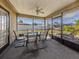 Covered patio featuring screened in porch and outdoor seating area overlooking the backyard at 1101 Southland Rd, Venice, FL 34293