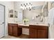 Spacious bathroom with double vanity, large mirror, and plenty of storage space at 11343 Bertolini Dr, Venice, FL 34292