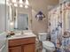 Bathroom features a single sink vanity, nautical decor and decorative shower curtain at 11343 Bertolini Dr, Venice, FL 34292