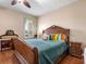 Bedroom with hardwood floors, wood furniture, natural light and neutral walls at 11343 Bertolini Dr, Venice, FL 34292