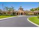 Attractive community clubhouse with well-maintained landscaping and covered entry at 11343 Bertolini Dr, Venice, FL 34292
