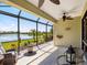 Enjoy the outdoor living space in the screened lanai with views of the lake at 11343 Bertolini Dr, Venice, FL 34292