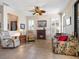 Spacious living room featuring a cozy fireplace, neutral paint, and natural lighting at 11343 Bertolini Dr, Venice, FL 34292