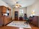 Office space with wood floors, decorative shelving, and bright window at 11343 Bertolini Dr, Venice, FL 34292