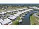 Aerial view showcasing homes along a canal with private docks and easy access to the open water at 120 Villa Dr # 120, Osprey, FL 34229