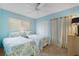 Bright bedroom with twin beds, neutral carpet, and plenty of natural light at 120 Villa Dr # 120, Osprey, FL 34229