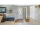 Inviting entryway with decorative glass door, ceramic tile floors, and coastal decor at 120 Villa Dr # 120, Osprey, FL 34229
