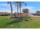 Charming single Gathering home with well-manicured lawn, mature palm trees and an attached two-car garage at 120 Villa Dr # 120, Osprey, FL 34229