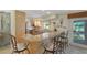 Bright kitchen featuring granite counters, modern appliances, and breakfast bar with seating at 120 Villa Dr # 120, Osprey, FL 34229