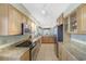 Updated kitchen showcasing granite counters, stainless steel appliances, and ample cabinet space at 120 Villa Dr # 120, Osprey, FL 34229