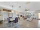 Spacious open concept living room with tile flooring, multiple seating areas, and access to the dining room at 120 Villa Dr # 120, Osprey, FL 34229