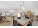 Open concept living room and kitchen with breakfast bar, tile floors, and comfortable seating at 120 Villa Dr # 120, Osprey, FL 34229