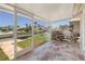The screened in porch includes tile flooring and tranquil water views at 120 Villa Dr # 120, Osprey, FL 34229
