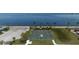 An aerial view of a waterfront basketball court available for community use with boat views on the horizon at 121 Dolly St, Punta Gorda, FL 33950